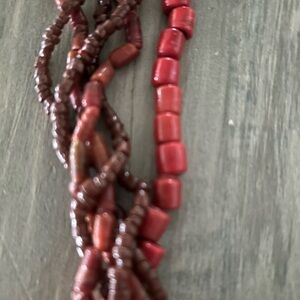 Beautiful multi strand necklace in cinnabar red . 29 inches